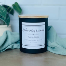 Load image into Gallery viewer, pampas grass highly scented coconut wax candle with crackling wood wick in black glass jar with wooden lid
