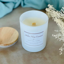 Load image into Gallery viewer, highly scented white tea thyme coconut wax candle with crackling wood wick in reusable white glass jar and wood lid

