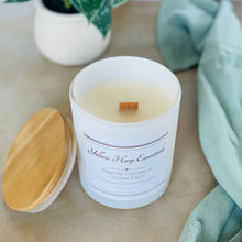 Load image into Gallery viewer, highly scented toasted coconut and stone fruit coconut wax candle with crackling wood wick in reusable white glass jar and wood lid