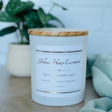 Load image into Gallery viewer, highly scented cactus flower and jade coconut wax candle with crackling wood wick in reusable white glass jar and wood lid
