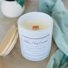 Load image into Gallery viewer, highly scented tropical ginger and lime coconut wax candle with crackling wood wick in reusable white glass jar and wood lid

