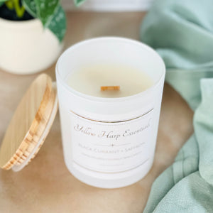 Black Currant + Saffron scented coconut wax candle with crackling wood wick reusable matte white glass jar wood lid