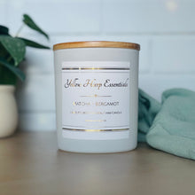 Load image into Gallery viewer, yellow harp essentials highly scented hand poured coconut wax candle with crackling wood wick in glass white jar with wood lid. Matcha and bergamot scent
