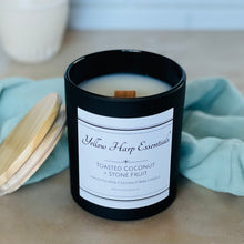 Load image into Gallery viewer, toasted coconut and stone fruit highly scented coconut wax candle in reusable black jar with wood lid and crackling wooden wick
