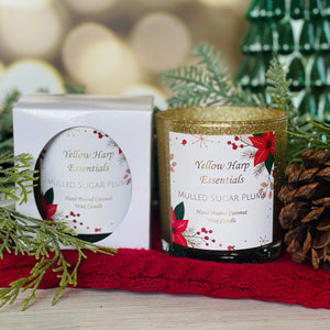 hand poured coconut wax candle with wood wick in gold glitter glass jar with white gift box mulled sugar plum