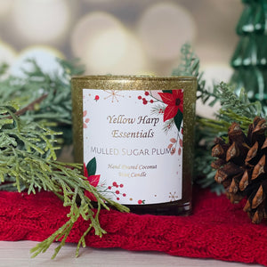 hand poured coconut wax candle with wood wick in gold glitter glass jar with white gift box mulled sugar plum