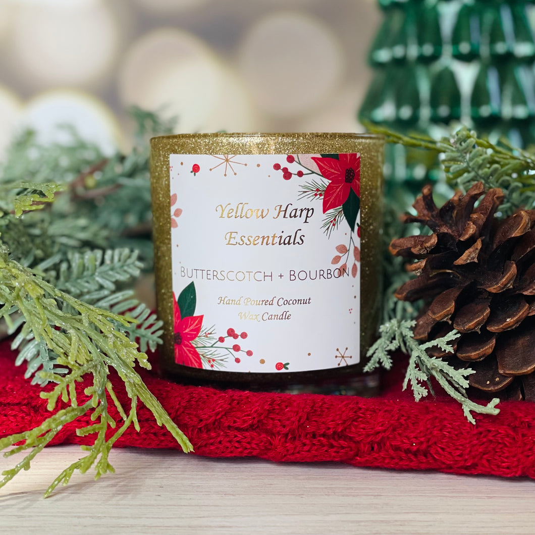 highly scented hand poured coconut wax candle with wood wick gold glitter glass jar white gift box butterscotch and bourbon scent