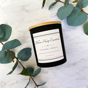 Cashmere and vanilla warm sexy sweet scented candle coconut wax crackling wood wick black jar creamy white wax