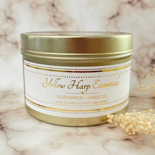 Load image into Gallery viewer, hand poured coconut wax candle with natural wood tube shape highly scented long lasting rosewater and hibiscus gold travel tin reusable with lid
