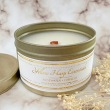 Load image into Gallery viewer, hand poured coconut wax candle with natural wood tube shape highly scented long lasting rosewater and hibiscus gold travel tin reusable with lid
