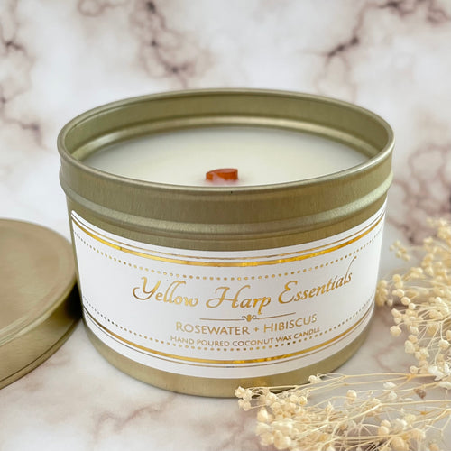hand poured coconut wax candle with natural wood tube shape highly scented long lasting rosewater and hibiscus gold travel tin reusable with lid