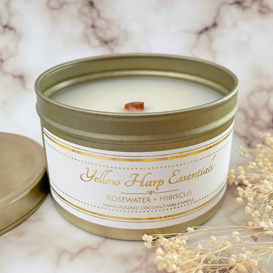 hand poured coconut wax candle with natural wood tube shape highly scented long lasting rosewater and hibiscus gold travel tin reusable with lid