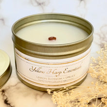Load image into Gallery viewer, hand poured coconut wax candle with natural wood crackling tube shaped wick highly scented long lasting lemon blossom and spruce reusable gold tin and lid
