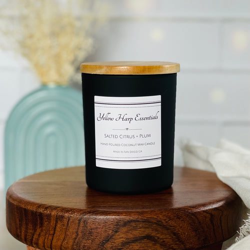 5 ounce black matte reusable jar with wood lid salted citrus plum scented candle coconut wax wooden wick