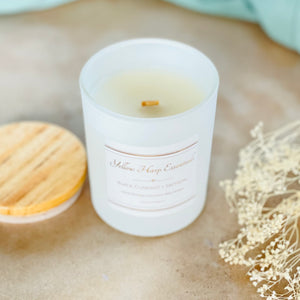 Black Currant + Saffron scented coconut wax candle with crackling wood wick reusable matte white glass jar wood lid