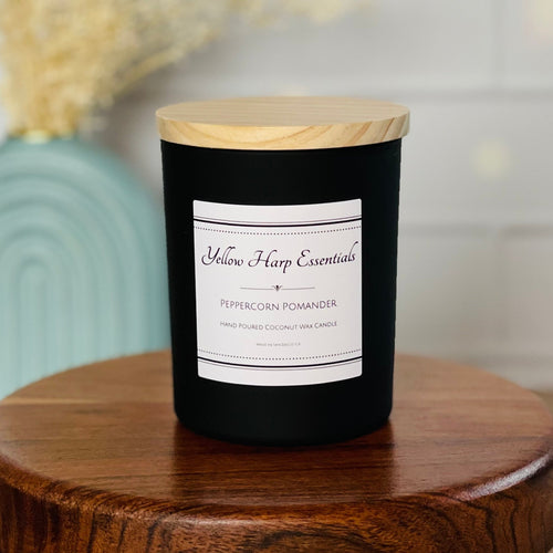 Peppercorn Pomander scented coconut wax candle with crackling wood wick reusable matte black glass jar wood lid
