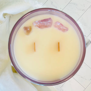 large 14 ounce coconut wax candle with double crackling wood wicks in a glass reusable purple jar raw amethyst stones highly scented white rose and neroli in linen bag